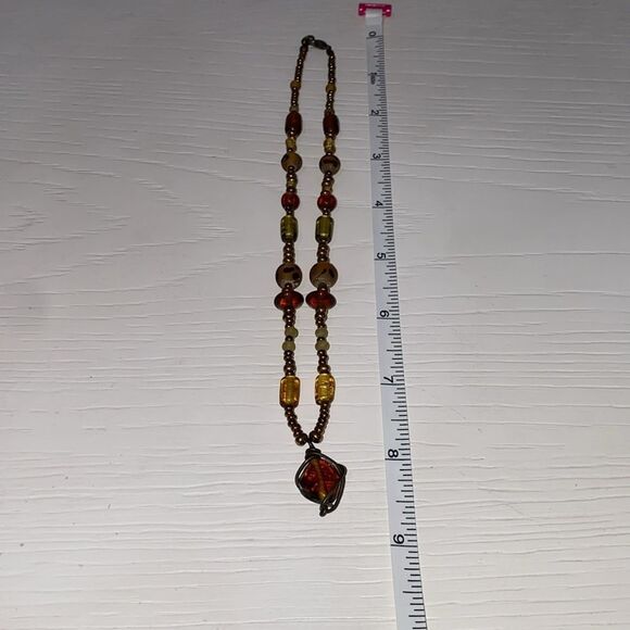 Vintage Boho Beaded Necklace with Drop Dangle Caged Bead Brown and Gold Accents - Picture 11 of 11